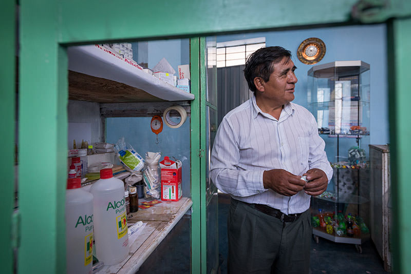 Erineo Lapa, Angel’s grandfather, keeps a well-stocked medicine cabinet that serves neighborhood families with everything from aspirin to penicillin shots.