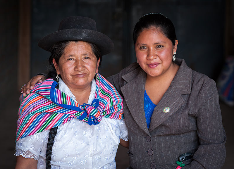 Former sponsored child Denisse Pariona Lunasco, 24, and her mother, Aurora Lunasco, represent the past and present of Quechua women in Huanta.