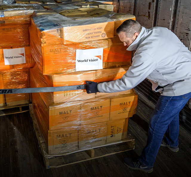 Man loading supplies into truck