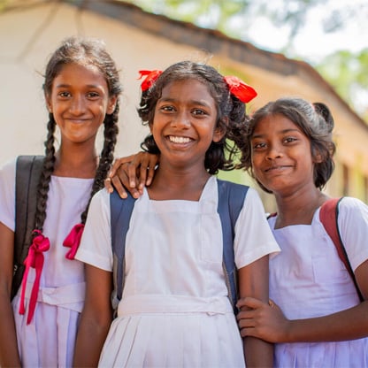 little girls at school smiling