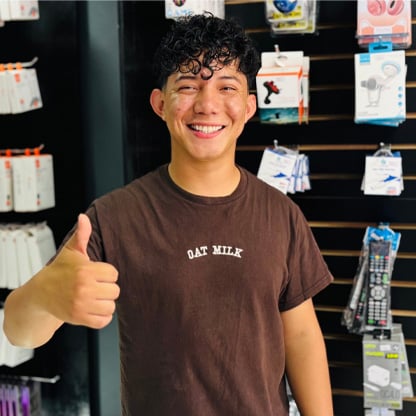 image of young man holding a thumbs up