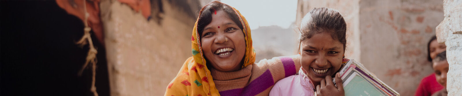 two women laughing together