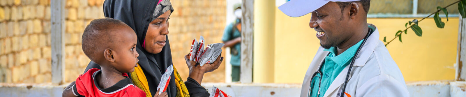 woman receiving food from worker