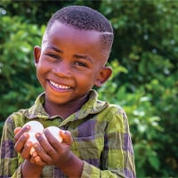 little boy holding eggs