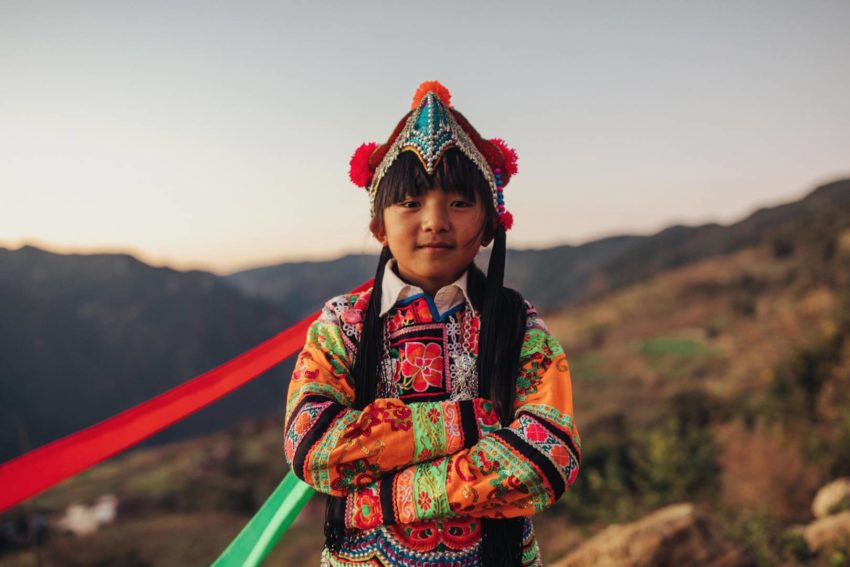 Traditionally dressed girl in rural China. The red carpet at the Academy Awards is crowded with glamorous gowns and tailored tuxedos as Hollywood stars put their best foot forward. We’ve got our own best-dressed list: children around the world who celebrate their cultural pageantry with traditional clothing.