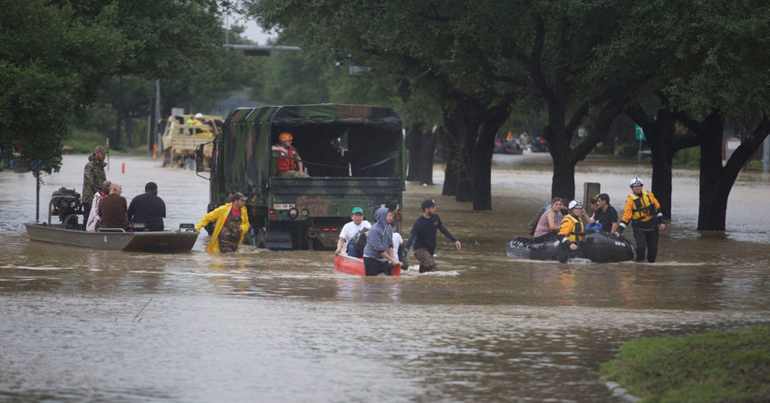 Rescue workers evacuate people in the residential areas of Texas from floodwaters during the aftermath of Hurricane Harvey on August 29, 2017.
