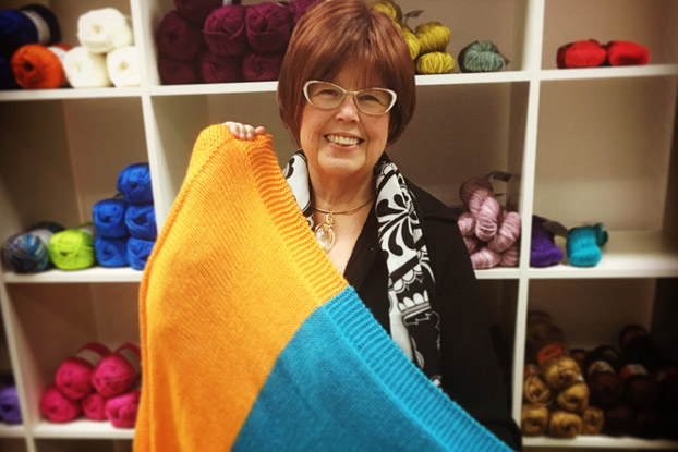 When author Debbie Macomber looked around at the needs in this world, it could feel overwhelming. She asked, “What can I do?” The answer was, "We can knit."