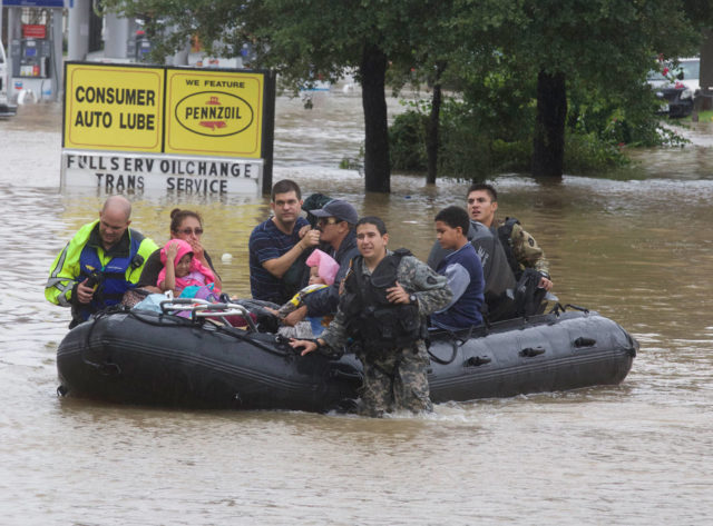 Rescue workers evacuate people from floodwaters during the aftermath of Hurricane Harvey on Tuesday, Aug. 29, 2017. (©2017 Genesis Photos/photo by Bradley J. Hodges)