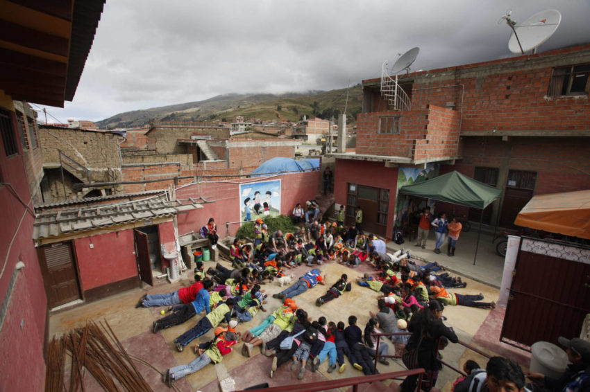 Children in Colomi, Bolivia, gather for more than just fun and games in a World Vision program designed to help them overcome poverty, malnutrition and a stark future. (©2014 World Vision/photo by Gary Fong/Genesis Photos)