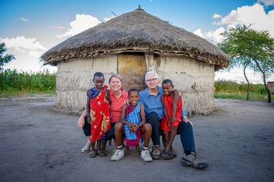 Rich Stearns, World Vision US President, and his wife, Renee', sit with Maasai children in Tanzania.