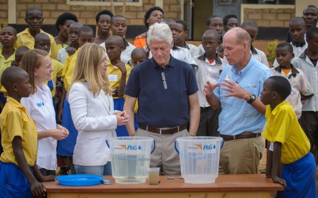 Former U.S. President Bill Clinton and daughter Chelsea got a personal look at the toll of unsafe water, as part of a visit to a primary school in Rwanda.