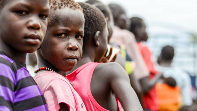 As South Sudanese refugees arrive in Uganda, they reach a new, unwanted home — but life in these homes hacked from the Ugandan bush is their best option.