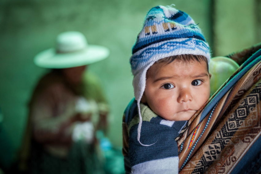 Baby on mother's back in Bolivia. Pray for South America.