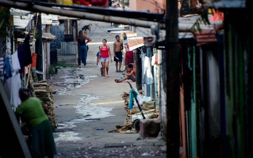 People walking in a street in El Salvador. Pray for Central America.