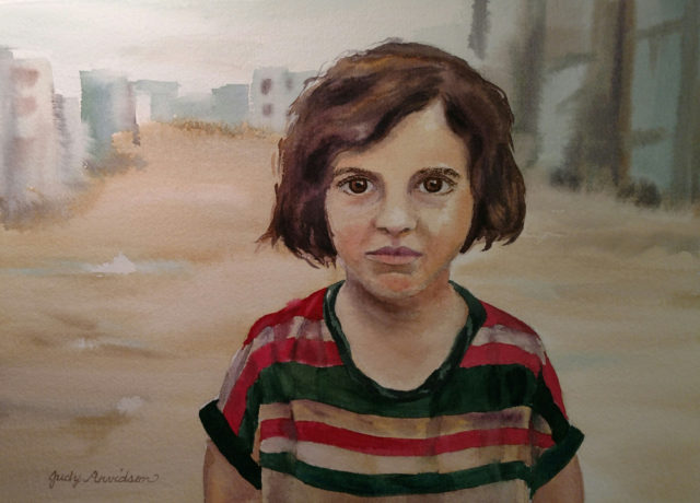 Syrian refugee girl standing in road in refugee camp.