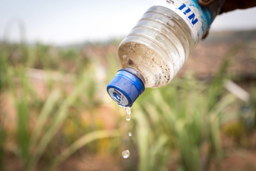 World Vision teaches farmers how to use readily available materials to create a homemade bottle drip irrigation system. Try this in your own garden!