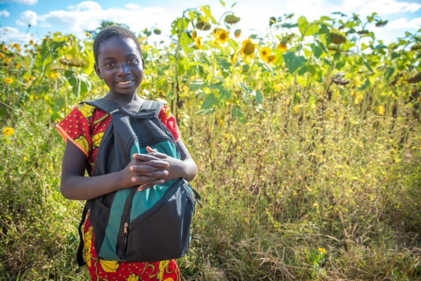 Ivy in Moyo, Zambia, was delighted to receive a World Vision Promise Pack, which contains school supplies, hygiene items, and an insect-repelling blanket.