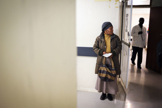 Emily Mphahlele waits at the hospital in South Africa for a doctor to review her anti-retroviral prescription.