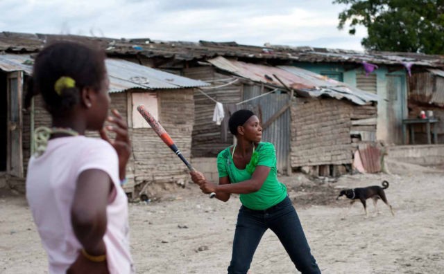 Girls in the Dominican Republic play baseball. Before each game, they pray and talk about issues that keep them reaching their full potential.