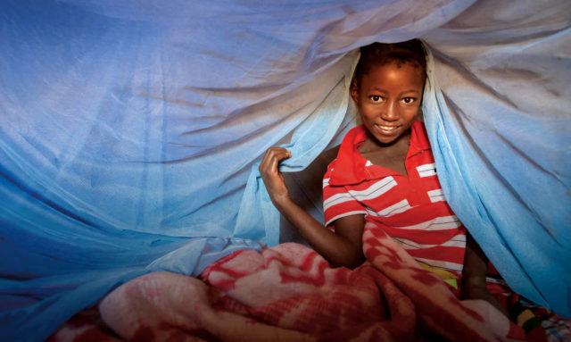 Delfina in Mozambique is protected from malaria-carrying mosquitos thanks to her bed net.
