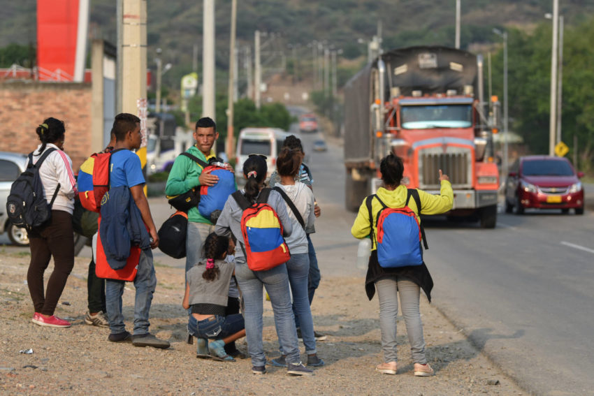 Venezuelan migrants walking through Colombia try to hitch a ride. They crossed the border at Cucuta, Colombia, early in the day and walked through the city. The road takes them through steep terrain and high elevations where nights are often below freezing. Every Venezuela migrant has a deeply personal story about why and how they left their country. They say after months and years of struggling to make ends meet, there came a turning point.