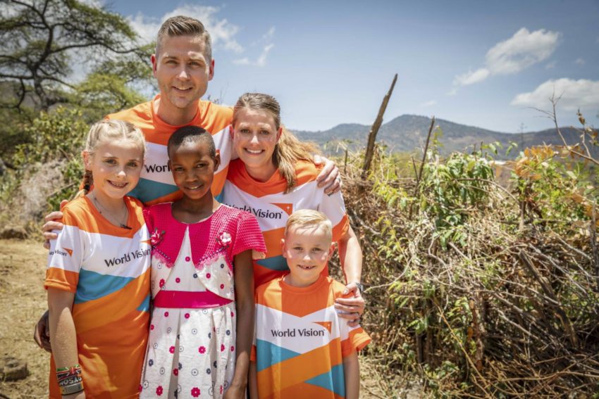 An American family poses with a Kenyan girl in Kenya.