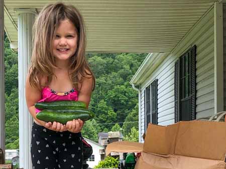 Four-year-old Phoenix in West Virginia was giddy with delight when she saw cucumbers in the Fresh Food Box she received from World Vision through its partnership with Mountain Heart Community Services.