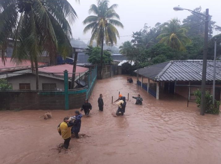 People wade through a flooded community in northern Nicaragua.