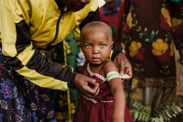 Portrait of a girl whose arm circumference is being measured.