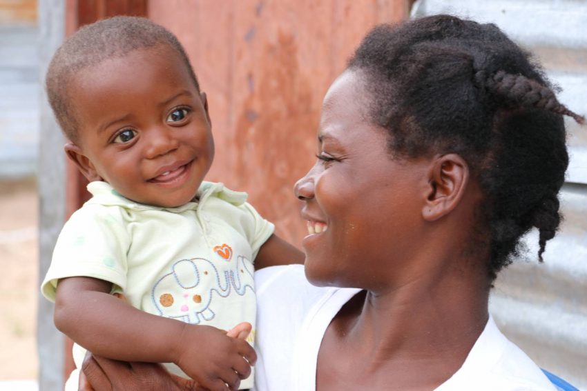 One-year-old Beto — now the picture of health — lights up when his mother, Ndahambelela, holds her face close to his.
