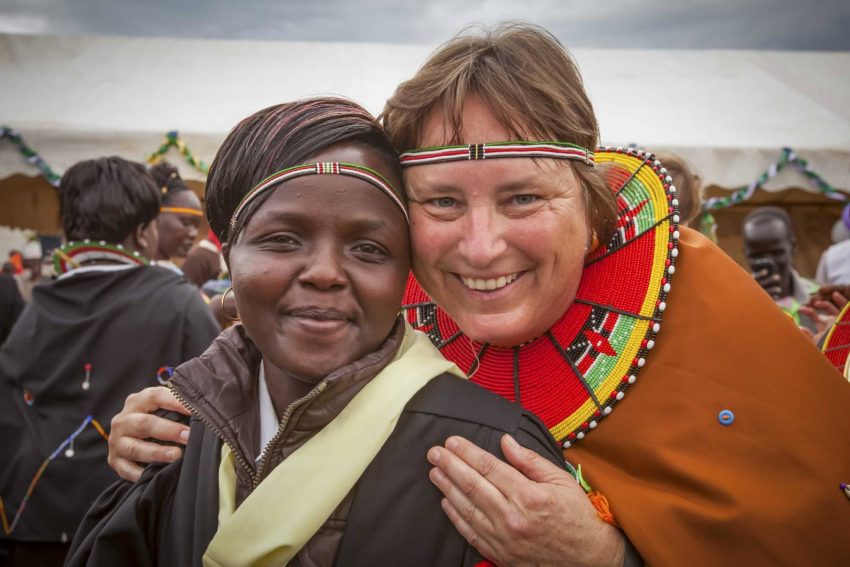 Margo Day smiles with a friend named Lillian during Margo’s 2014 trip to Kenya to celebrate an expansion of the school she funded. She initially met Lillian during a 2009 visit at the rescue center.