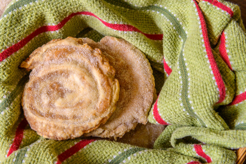 Tahini, cinnamon, and sugar-filled rolls sit on a table, ready to enjoy.