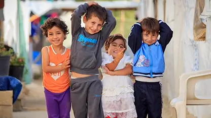 Sponsored children smiling in a high-risk area