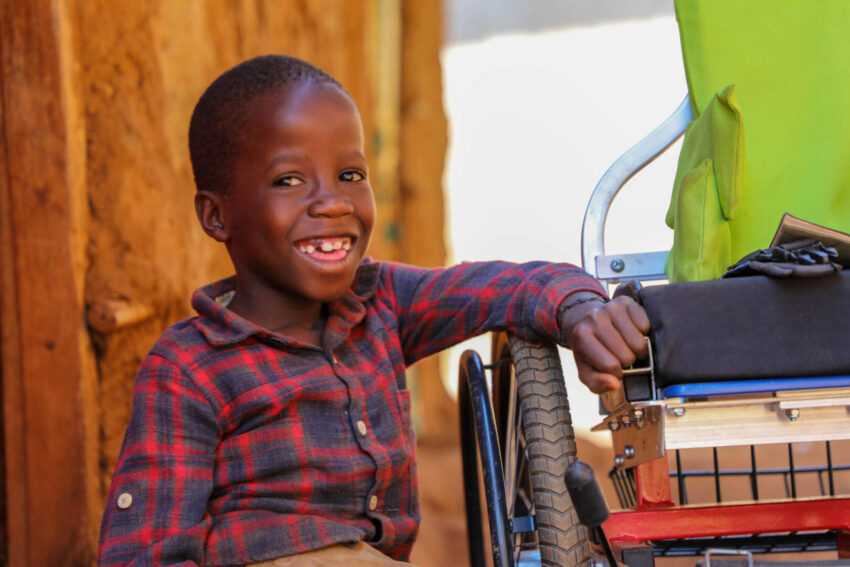 A Ugandan boy’s new wheelchair, provided by World Vision, enables him to be more mobile and independent.