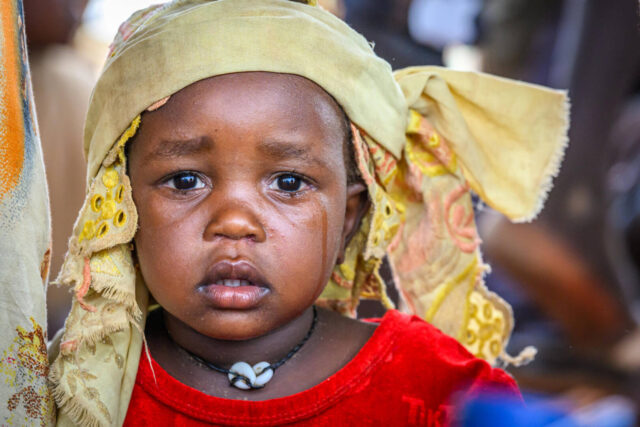 Sudanese refugees arriving from Darfur, Sudan, at the Chad border crossing in Adre