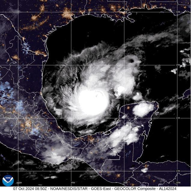 A satellite image shows a massive well-defined, swirling cloud structure moving in the Gulf of Mexico.