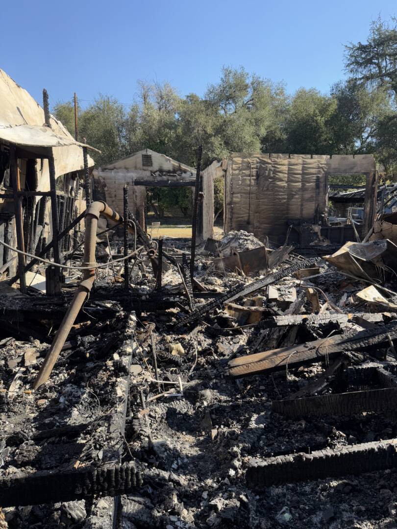 Piles of burned remains are scattered everywhere in what used to be a house.