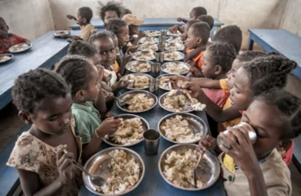Screenshot 2025-02-25 at 10.36.30 AM group of children eating a meal together at a table