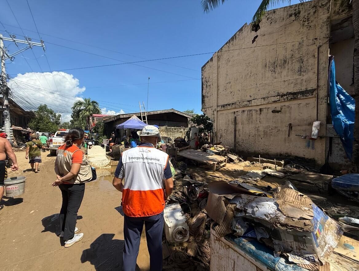 World Vision aid workers survey debris and damage in the aftermath of a deadly typhoon in the Philippines