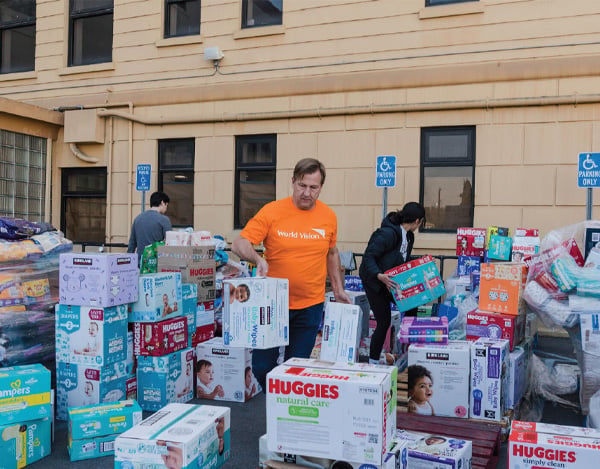 world vision worker organizing diapers