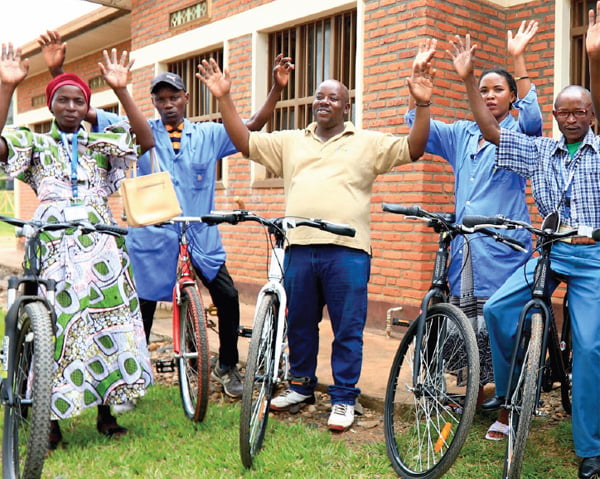 group of people raising their hands