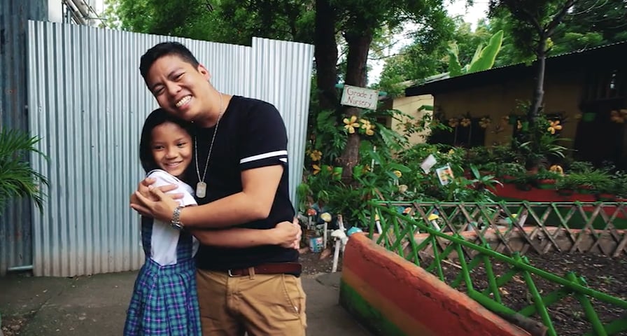 hugging sponsored child