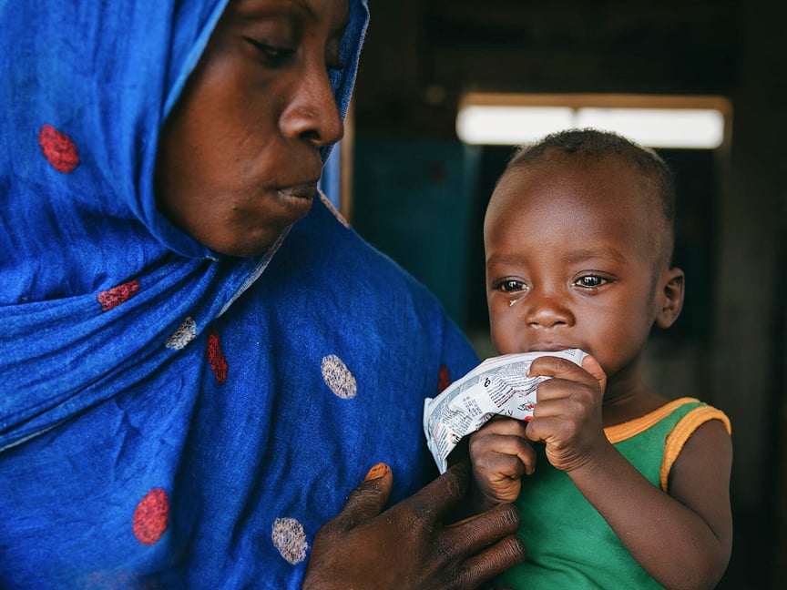 mother feeding child