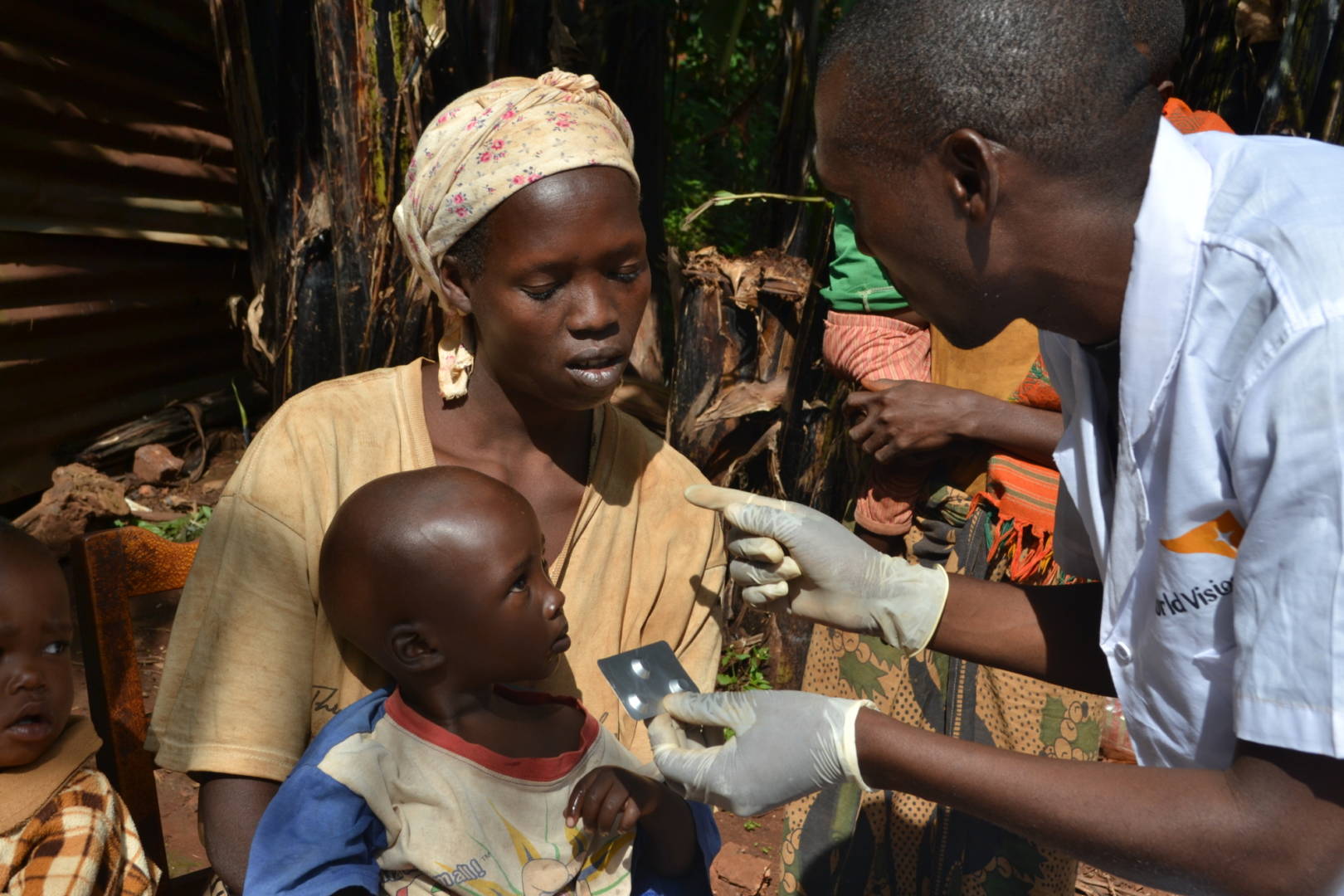 At his home in northeast Burundi, community health worker Diomede, right, diagnoses and treats common ailments of children under age 5. Malaria is among the three most deadly diseases for children this young. (©2016 World Vision, Javan Niyakire)