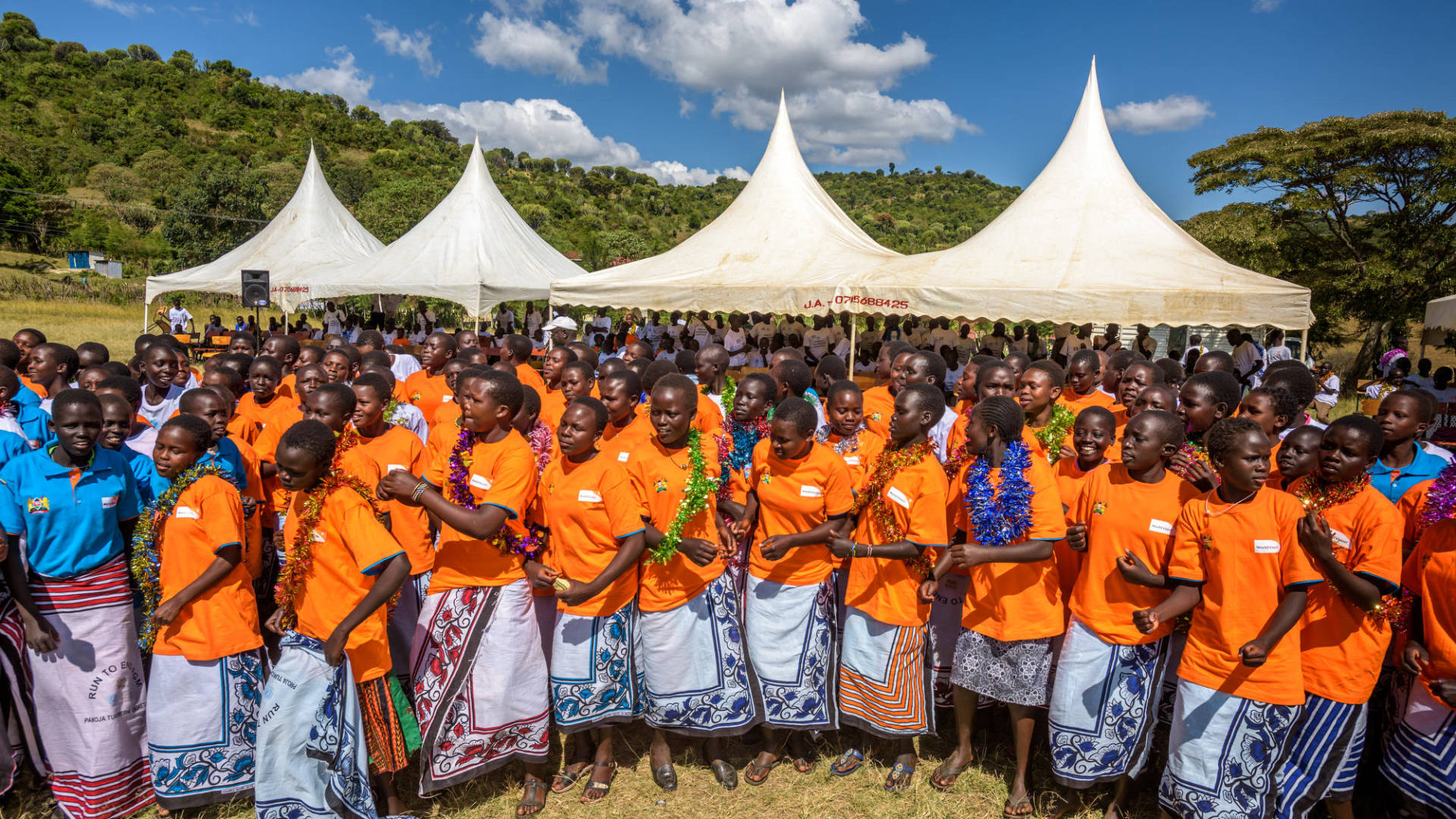 Teens celebrate graduation from a World Vision alternative rite of passage in West Pokot County, Kenya. Five hundred boys and girls took part in training to prevent female genital mutilation (FGM).