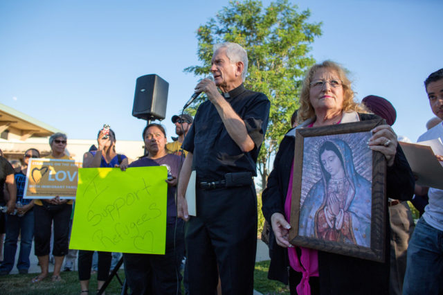 Father Jack Barker of St. Martha’s Catholic Church in Murrieta, Calif., spoke at a vigil. Credit Monica Almeida/The New York Times