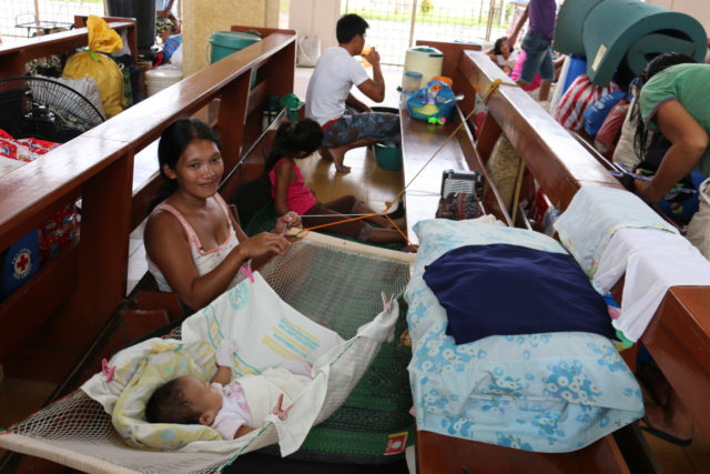 Families take shelter inside evacuation centers throughout Tacloban, in advance of the approach of Typhoon Hagupit to the Philippines. PHOTO: World Vision / Cristie Macabe