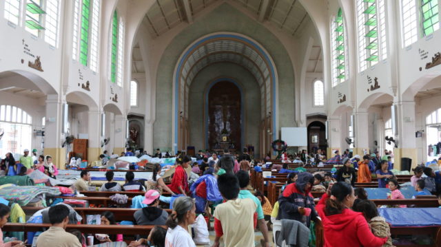 Families seek shelter in Redemptorist Church in Tacloban after Typhoon Hagupit brought punishing wind and rain to the Philippines. PHOTO: World Vision / Joy Maluyo