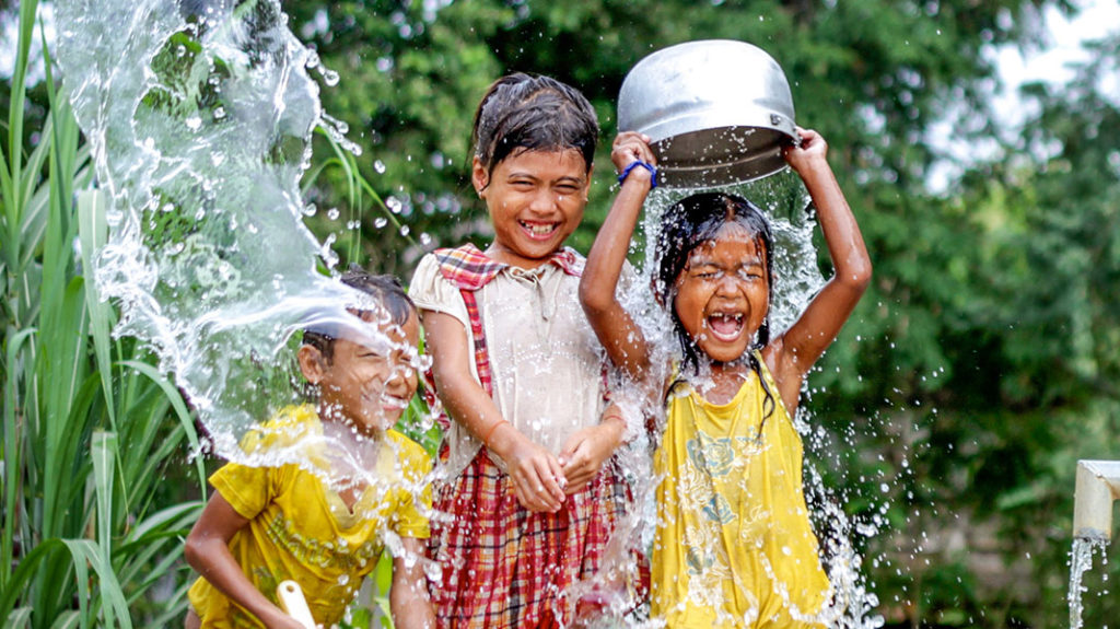 Kids enjoying clean water.