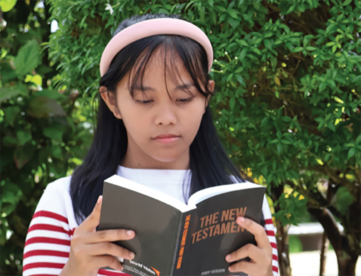 girl reading bible